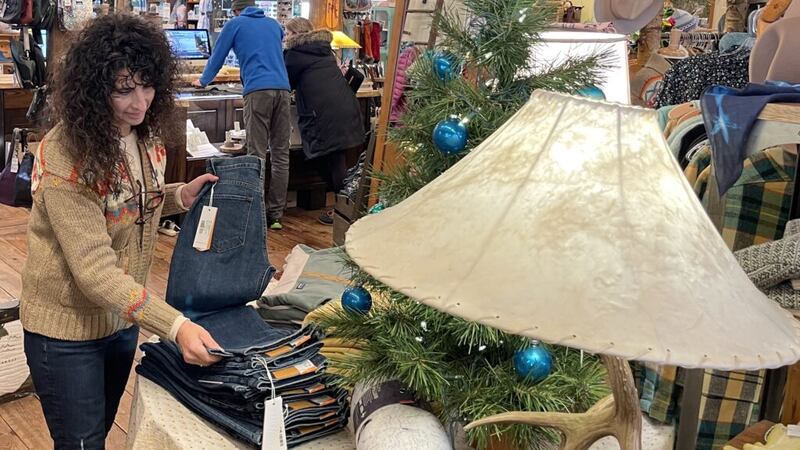 DeAnn Echols, owner of the Great Outdoor Store in downtown Sioux Falls, prepares for the...