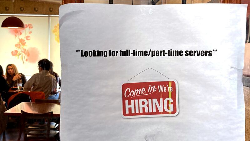 FILE - A hiring sign is displayed at a restaurant in Morton Grove, Ill., Thursday, April 28,...