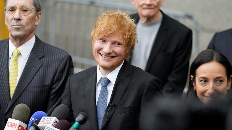 Recording artist Ed Sheeran prepares to speak to the media outside New York Federal Court...