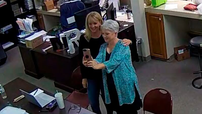 In this Jan. 7, 2021, image taken from Coffee County, Ga., security video, Cathy Latham...