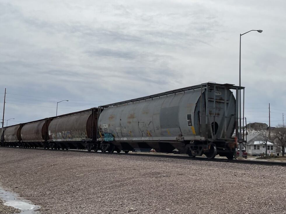 Freight cars that can hold liquids bring up the rear of a train that moved through downtown...