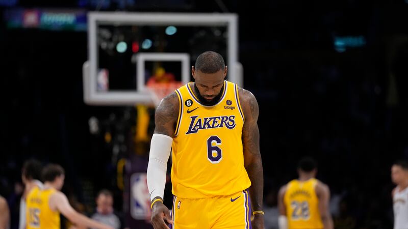 Los Angeles Lakers forward LeBron James looks down in the closing minutes of a loss to the...